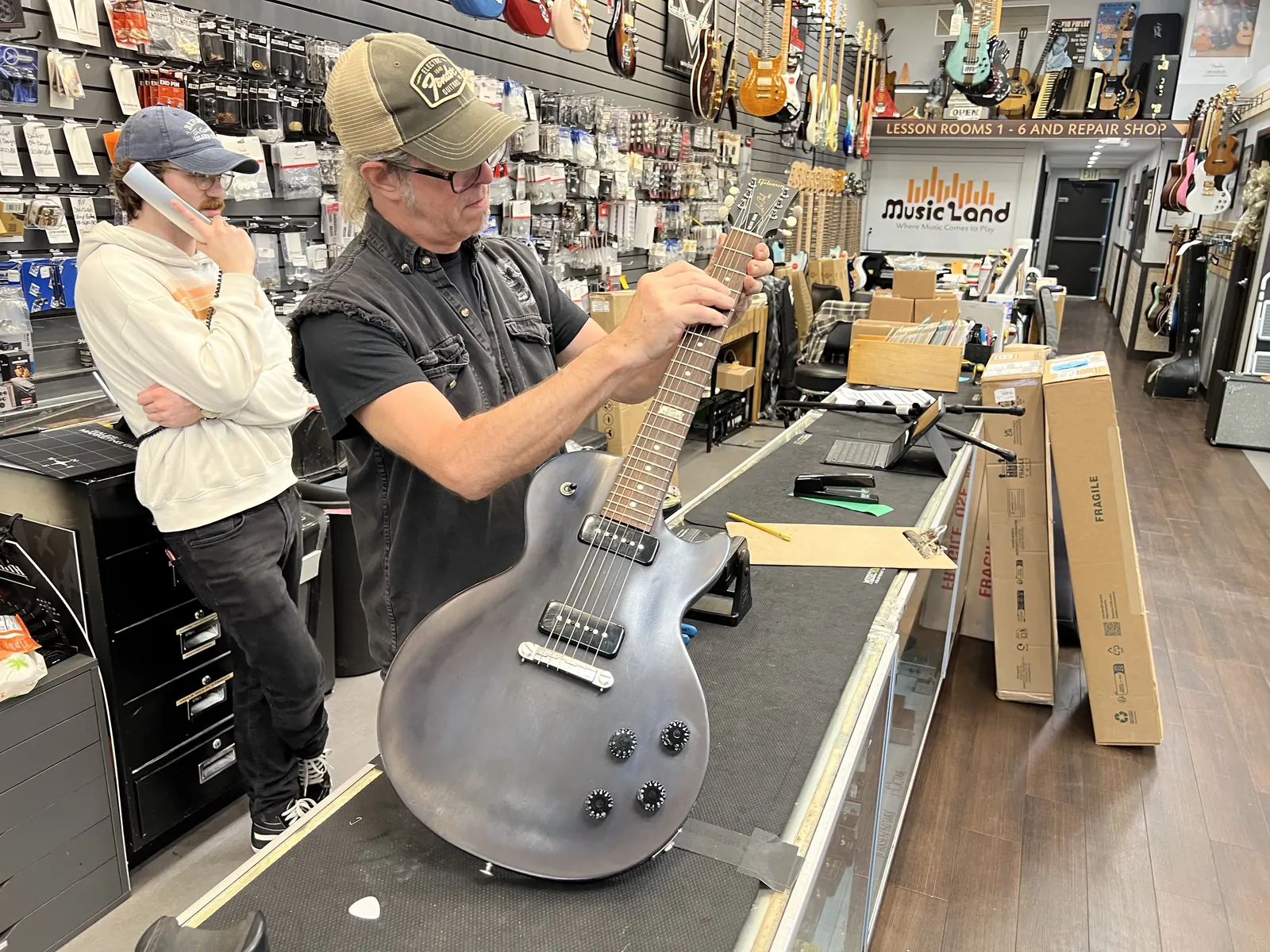 Instrument repair technician working at Music Land in Bel Air Maryland