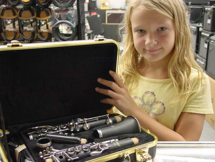 Parent and student choosing a school band instrument rental at Music Land in Bel Air MD